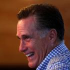 US Republican presidential nominee and former Massachusetts Governor Mitt Romney laughs as he...