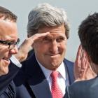 US Secretary of State John Kerry (C) salutes to bid farewell as he prepares to depart from...