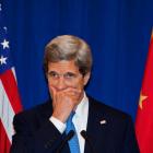 US Secretary of State John Kerry listens to questions during a news conference in Beijing....