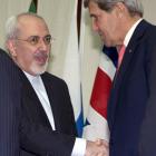 US Secretary of State John Kerry (right)  with Iranian Foreign Minister Mohammad Javad Zarif at...
