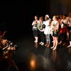 Uzo Nwankpa (centre),  her mothers and babies accept appaluse after their performance at Allen...