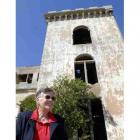 Val Wilson stands by the ruins of her former home, Cargill's Castle. To her right is what was her...
