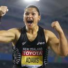 Valerie Adams of New Zealand celebrates after her attempt during the women's shot put final at...