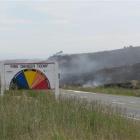 Vegetation smoulders after yesterday's fire at Flat Top Hill, near Alexandra. Photo by John Douglas.