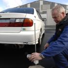 Vehicle Inspection New Zealand compliance certifier John Murdoch, of Dunedin, uses a digital...