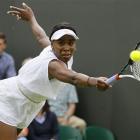 Venus Williams of the US returns a shot to Uzbekistan's Akgul Amanmuradova during their first...