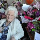 Vera Tourell with some of the gifts and cards she received for her 100th birthday at Little...