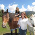 Vicki Bonham-Hoskin, with daughter Rebekah (7), has her hands full keeping the Spirit of Equus...