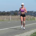 Victoria Taylor nears Glenavy on State Highway 1 yesterday during her big run  to raise awareness...