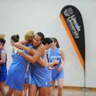 Villa Maria College goal shoot Grace Prendergast (left) and goal keep Joanna Trip share a hug to...