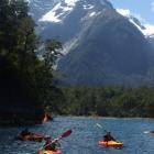 Visitors paddle back to the Discovery Centre, with Harrisons Valley and the Pembroke Glacier  in...