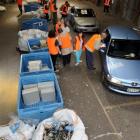 Volunteers collect electronic equipment from cars during last month's eDay collection in Dunedin....