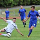 WaiBOP United midfielder Wade Molony (left) and Southern United midfielder Tim McLennan compete...