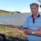 Waihola Looking Forward chairman Stu Michelle (right) stands at Lake Waihola, where the group is...