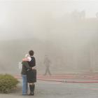 Waihola Tavern co-owner Annette Reid is comforted by daughter Paula Dore as fire extensively...