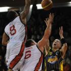 Waikato Pistons players Jerry Smith (left) and Marco Alexander defend against Otago Nugget player...
