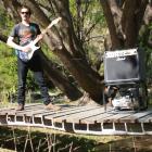 WaikeriFest organiser Andy Parsons, of Dunedin, tests out part of the stream-side location for...