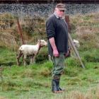 Waikouaiti farmer Paul Bartlett with two of the seven sheep that remain of his flock of 24 after...