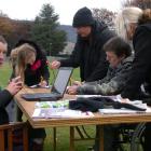 Waimate district councillor Sandy Mulqueen (left) gathers signatures from Di Gould, Stacey Dunn,...
