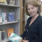 Waitaki district libraries manager Lorraine Weston-Webb admires the new display cabinets for the...
