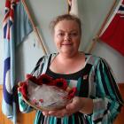 Waitaki District RSA Welfare Trust secretary Debbie Sinclair holds a basket of WW1 commemorative...