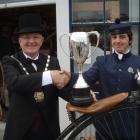 Waitaki Mayor Alex Familton poses with  national men's penny-farthing champion Mitchell Fox...