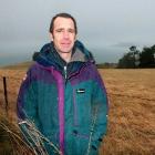 Waitati wind: Scott Willis braves the elements just below a proposed wind generation site...