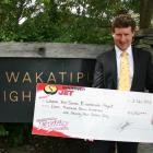 Wakatipu High School principal Steve Hall with a cheque for $11,747, raised through the Shotover...