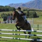 Wakatipu Pony Club member Emma Milliken marshals her horse, 45 South, over a gate in the...