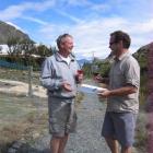 Wakatipu Trails Trust chairman Terry Stevens (left) and Henry van Asch toast to the signing of...