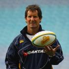 Wallabies head coach Robbie Deans spins a ball on his fingertips during Australia's captain's run...