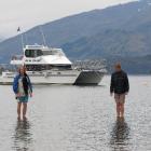 Wanaka brothers Mathew (17, left) and Jakub Green (19) stand on the submerged jetty piles in Lake...
