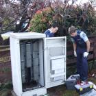 Wanaka police officers Emma Fleming (left) and Pete Reed examine one of two damaged...
