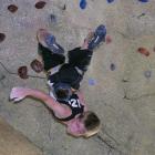 Wanaka's Finn Fairbairn dangles from the ceiling of the recently reopened Basecamp clip and climb...