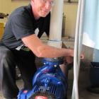 Wanaka swimming pool maintenance man Mario De Bono completes the installation of a new pump...