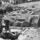 Watched by Cliff Donaldson, Alf Wootten (left) at work on the rock garden's water feature.