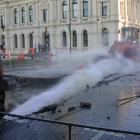 Water pours from a cut connection     to the Thames St water main yesterday afternoon, closing...