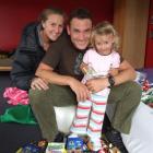 Wayne Oxenham, with the help of wife Lynne and daughter Ashley, packs his bag full of sweets in...