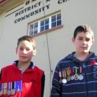 Wearing their great-grandfathers' war medals are (from left) Jamie Brown (9), of Omakau, and...