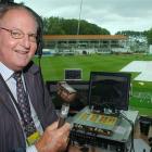 West Indies broadcaster Tony Cozier waits - in vain - for the weather to clear at the University...