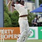 West Indies fast bowler Jerome Taylor shows his delight at scoring his maiden test century...