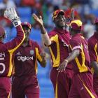 West Indies players celebrate their victory over India in the fourth one-day international in St....