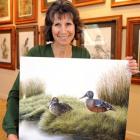 Westwood-based wildlife artist Karen Baddock (44) with her painting of New Zealand shoveller...