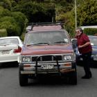 Whai Walker, of Rockside Rd, in Dunedin, talks to neighbour and driver of the 4WD Jeff Huuskes,...