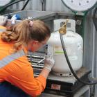 What price lpg? Katrina Lloyd from Nova LPG fills a bottle. Photo by Craig Baxter.