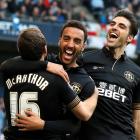Wigan Athletic's James Perch (C) celebrates with teammates James McArthur (L) and Jordi Gomez...