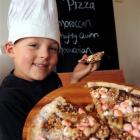 William Mooney with the dessert pizza he designed, which is now on the menu of The Bay Cafe in...