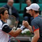 Winner David Ferrer of Spain (L) shakes hands with Andy Murray of Britain after their...