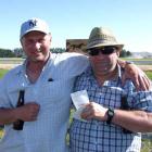 Winners a grinners. . . . Trifecta winners Geoff Scully (left), of Invercargill, and Glenn ...