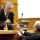 Witness Peter Hentschel (left) and defence counsel Michael Reed QC point to the murder weapon.